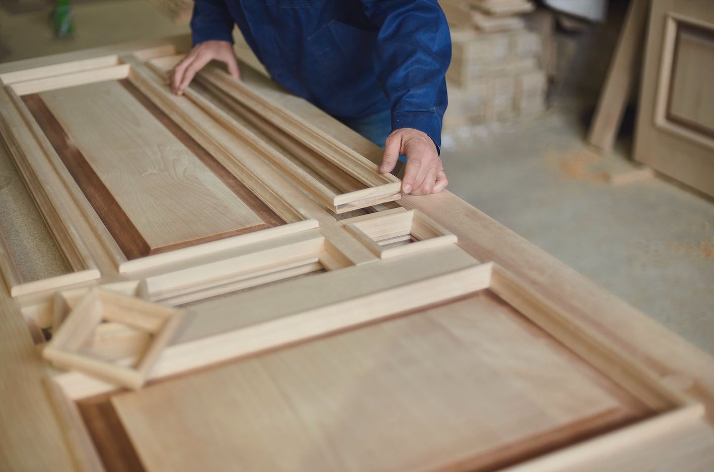 Carpenter assembling a custom wooden door